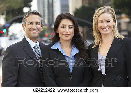 Stock Image - Portrait Of Three Business Colleagues Outside Office. Fotosearch