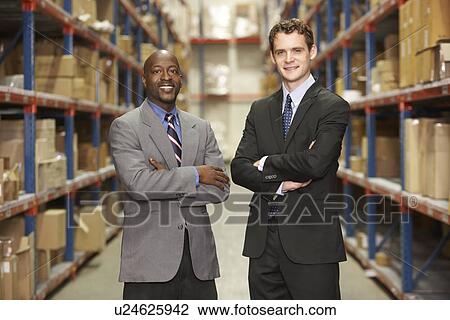 Portrait Of Two Businessmen In Warehouse View Large Photo Image Stock Image - Portrait Of Two Businessmen In Warehouse. Fotosearch