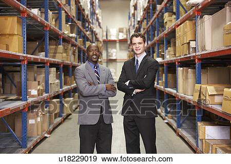 Portrait Of Two Businessmen In Warehouse View Large Photo Image Stock Photo - Portrait Of Two Businessmen In Warehouse. Fotosearch