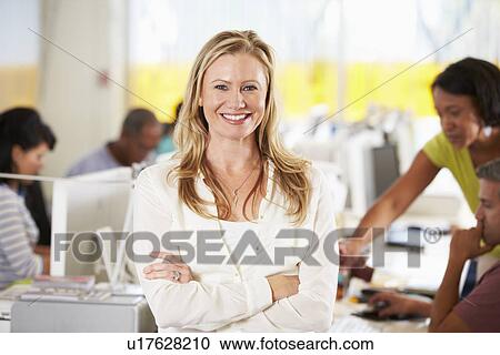 Portrait Of Woman Standing In Busy Creative Office View Large Photo Image Stock Image - Portrait Of Woman Standing In Busy Creative Office. Fotosearch