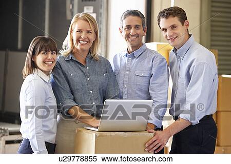 Portrait Of Workers In Distribution Warehouse View Large Photo Image Stock Photography - Portrait Of Workers In Distribution Warehouse. Fotosearch