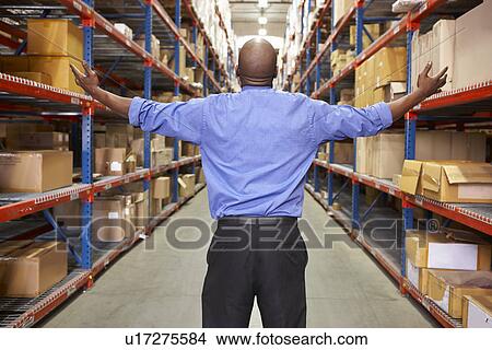 Rear View Of Businessman In Warehouse View Large Photo Image Picture - Rear View Of Businessman In Warehouse. Fotosearch