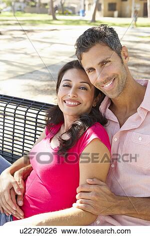 Romantic Couple Sitting On Park Bench Together View Large Photo Image Stock Photograph - Romantic Couple Sitting On Park Bench Together. Fotosearch