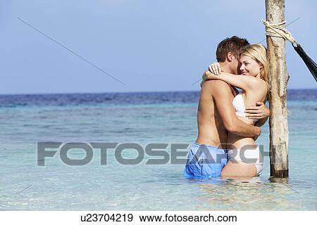 Romantic Couple Standing In Beautiful Tropical Sea View Large Photo Image Stock Photo - Romantic Couple Standing In Beautiful Tropical Sea. Fotosearch