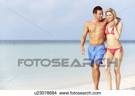 Romantic Couple Walking On Beautiful Tropical Beach View Large Photo Image Picture - Romantic Couple Walking On Beautiful Tropical Beach. Fotosearch