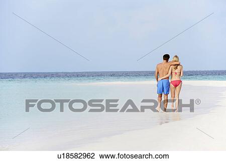 Romantic Couple Walking On Beautiful Tropical Beach View Large Photo Image Stock Image - Romantic Couple Walking On Beautiful Tropical Beach. Fotosearch
