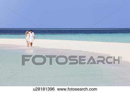 Romantic Couple Walking On Beautiful Tropical Beach View Large Photo Image Stock Photograph - Romantic Couple Walking On Beautiful Tropical Beach. Fotosearch