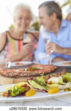 Senior Couple Enjoying Meal In Outdoor Restaurant View Large Photo Image Stock Image - Senior Couple Enjoying Meal In Outdoor Restaurant. Fotosearch