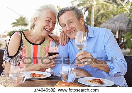 Senior Couple Enjoying Meal In Outdoor Restaurant View Large Photo Image Stock Image - Senior Couple Enjoying Meal In Outdoor Restaurant. Fotosearch