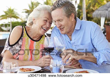 Senior Couple Enjoying Meal In Outdoor Restaurant View Large Photo Image Stock Photo - Senior Couple Enjoying Meal In Outdoor Restaurant. Fotosearch
