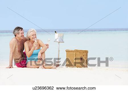Senior Couple On Beach With Luxury Champagne Picnic View Large Photo Image Stock Image - Senior Couple On Beach With Luxury Champagne Picnic. Fotosearch