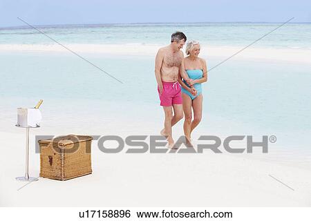 Senior Couple On Beach With Luxury Champagne Picnic View Large Photo Image Stock Photograph - Senior Couple On Beach With Luxury Champagne Picnic. Fotosearch