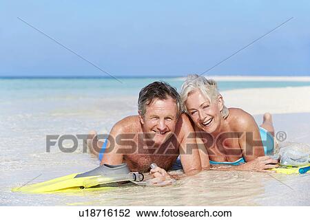 Senior Couple With Snorkels Enjoying Beach Holiday View Large Photo Image Stock Image - Senior Couple With Snorkels Enjoying Beach Holiday. Fotosearch