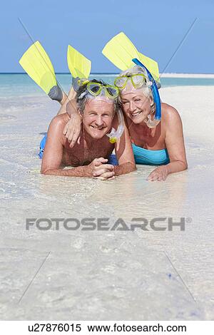 Senior Couple With Snorkels Enjoying Beach Holiday View Large Photo Image Stock Photography - Senior Couple With Snorkels Enjoying Beach Holiday. Fotosearch