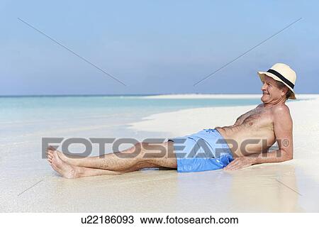 Senior Man Enjoying Beach Holiday View Large Photo Image Stock Image - Senior Man Enjoying Beach Holiday. Fotosearch