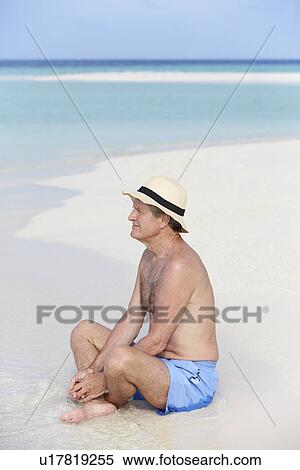 Senior Man Enjoying Beach Holiday View Large Photo Image Stock Photography - Senior Man Enjoying Beach Holiday. Fotosearch