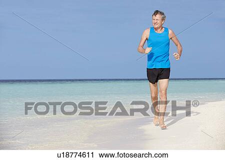 Senior Man Running On Beautiful Beach View Large Photo Image Stock Image - Senior Man Running On Beautiful Beach. Fotosearch