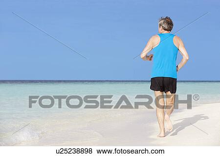 Senior Man Running On Beautiful Beach View Large Photo Image Stock Photo - Senior Man Running On Beautiful Beach. Fotosearch