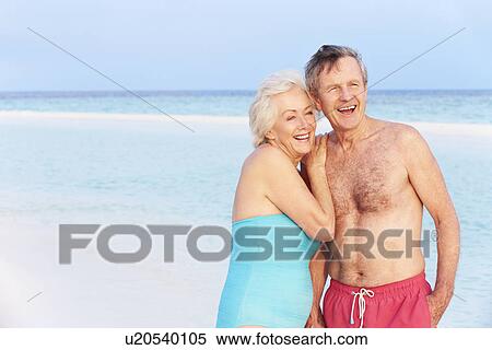 Senior Romantic Couple Walking In Beautiful Tropical Sea View Large Photo Image Stock Photography - Senior Romantic Couple Walking In Beautiful Tropical Sea. Fotosearch