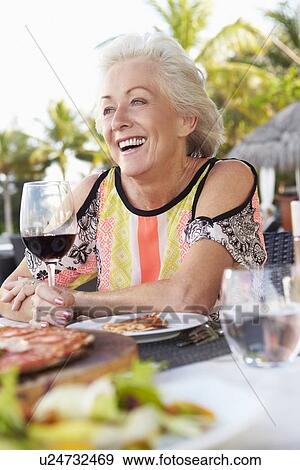 Senior Woman Enjoying Meal In Outdoor Restaurant View Large Photo Image Stock Photo - Senior Woman Enjoying Meal In Outdoor Restaurant. Fotosearch