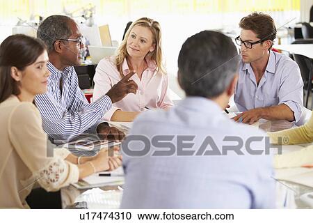 Stock Image - Team Meeting In Creative Office. Fotosearch
