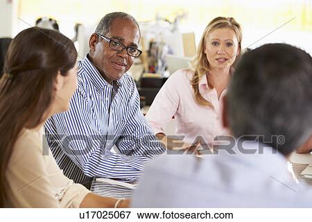 Team Meeting In Creative Office View Large Photo Image Stock Photo - Team Meeting In Creative Office. Fotosearch
