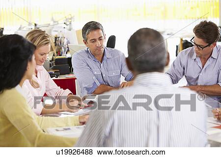 Team Meeting In Creative Office View Large Photo Image Stock Photo - Team Meeting In Creative Office. Fotosearch