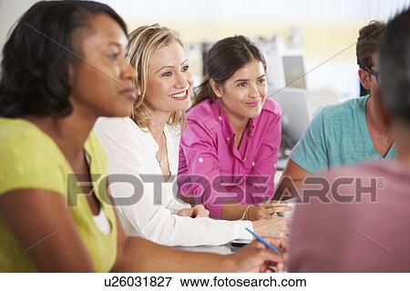 Team Meeting In Creative Office View Large Photo Image Stock Photo - Team Meeting In Creative Office. Fotosearch