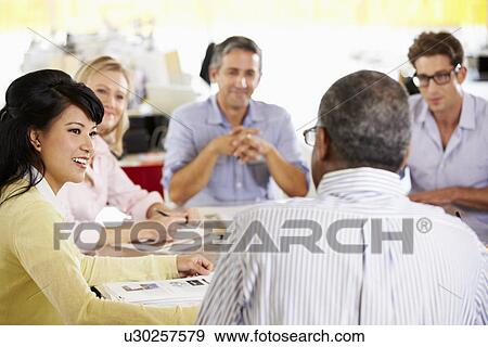 Team Meeting In Creative Office View Large Photo Image Stock Photo - Team Meeting In Creative Office. Fotosearch