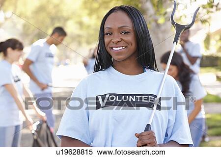 Team Of Volunteers Picking Up Litter In Suburban Street View Large Photo Image Stock Photography - Team Of Volunteers Picking Up Litter In Suburban Street. Fotosearch
