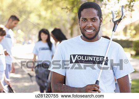 Team Of Volunteers Picking Up Litter In Suburban Street View Large Photo Image Stock Photography - Team Of Volunteers Picking Up Litter In Suburban Street. Fotosearch