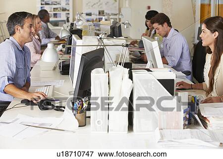 Team Working At Desks In Busy Office View Large Photo Image Stock Photo - Team Working At Desks In Busy Office. Fotosearch