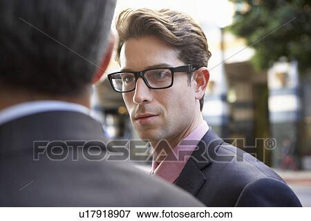 Two Businessman Chatting Outside Office View Large Photo Image Stock Photo - Two Businessman Chatting Outside Office. Fotosearch