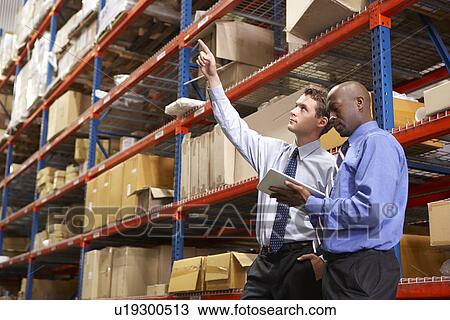 Two Businessmen With Digital Tablet In Warehouse View Large Photo Image Stock Image - Two Businessmen With Digital Tablet In Warehouse. Fotosearch