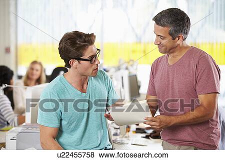 Two Men Meeting In Creative Office View Large Photo Image Stock Photo - Two Men Meeting In Creative Office. Fotosearch