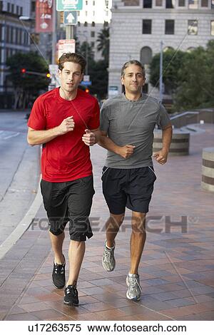 Two Men Running On Urban Street View Large Photo Image Stock Photography - Two Men Running On Urban Street. Fotosearch