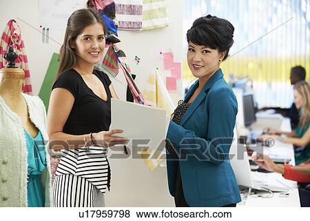 Two Women Meeting In Fashion Design Studio View Large Photo Image Stock Photo - Two Women Meeting In Fashion Design Studio . Fotosearch