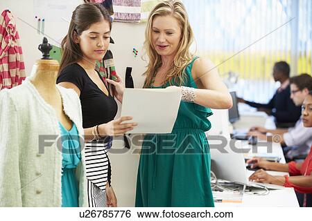 Two Women Meeting In Fashion Design Studio View Large Photo Image Stock Photograph - Two Women Meeting In Fashion Design Studio . Fotosearch