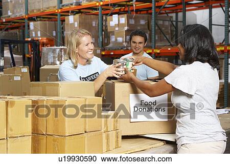 Volunteers Collecting Food Donations In Warehouse View Large Photo Image Stock Image - Volunteers Collecting Food Donations In Warehouse. Fotosearch