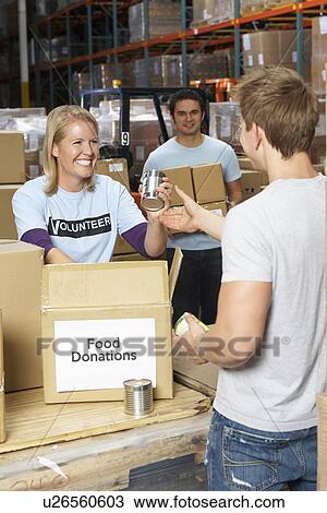 Volunteers Collecting Food Donations In Warehouse View Large Photo Image Stock Image - Volunteers Collecting Food Donations In Warehouse. Fotosearch