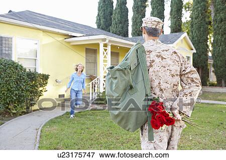 Stock Photo - Wife Welcoming Husband Home On Army Leave. Fotosearch