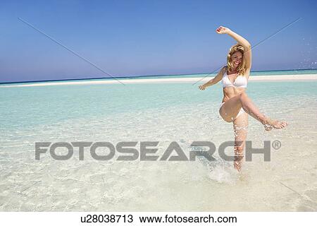 Woman Enjoying Beach Holiday View Large Photo Image Stock Image - Woman Enjoying Beach Holiday. Fotosearch