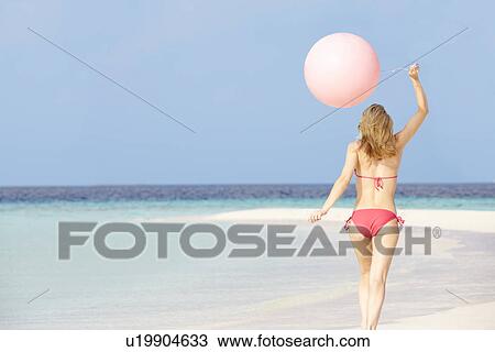 Woman In Bikini Running On Beautiful Beach With Balloon View Large Photo Image Stock Image - Woman In Bikini Running On Beautiful Beach With Balloon. Fotosearch