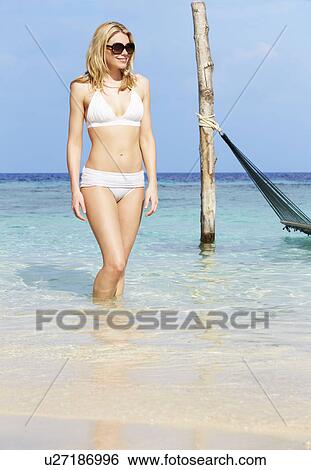 Woman In Bikini Standing In Beautiful Tropical Sea View Large Photo Image Stock Photograph - Woman In Bikini Standing In Beautiful Tropical Sea. Fotosearch