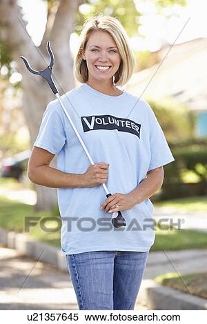 Woman Picking Up Litter In Suburban Street View Large Photo Image Stock Photography - Woman Picking Up Litter In Suburban Street. Fotosearch