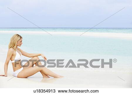Woman Sunbathing On Beautiful Beach Holiday View Large Photo Image Stock Image - Woman Sunbathing On Beautiful Beach Holiday. Fotosearch