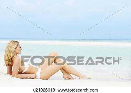 Woman Sunbathing On Beautiful Beach Holiday View Large Photo Image Stock Photo - Woman Sunbathing On Beautiful Beach Holiday. Fotosearch