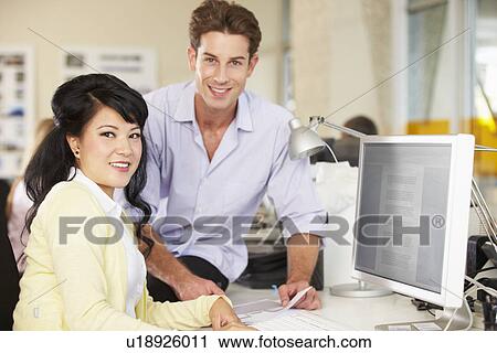 Workers At Desk In Busy Creative Office View Large Photo Image Stock Image - Workers At Desk In Busy Creative Office. Fotosearch