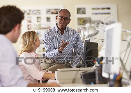 Workers At Desks In Busy Creative Office View Large Photo Image Stock Photo - Workers At Desks In Busy Creative Office. Fotosearch