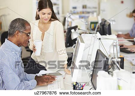 Workers At Desks In Busy Creative Office View Large Photo Image Stock Photograph - Workers At Desks In Busy Creative Office. Fotosearch